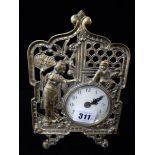 A desk clock with white enamel dial, in a pierced brass case decorated Geisha and child, easel back