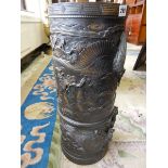 A Japanese bronze cylindrical stickstand decorated all round with birds and flowers – 21in. high