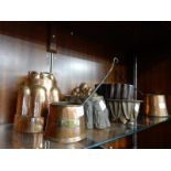 Four 19th Century copper jelly moulds and three graduated copper cider measures