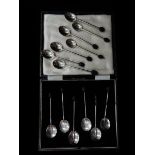 A case of six silver coffee spoons with bean terminals - Birmingham 1931 and seven Mappin and Webb