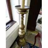 A brass floor standing lamp with turned column, on circular base