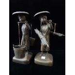 A pair of Chinese bronze figures of coolies, one with two buckets, the other bundles of sticks