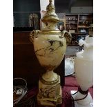 A plaster tablelamp base with scagliola style marble decoration, fitted twin gilded rams head