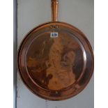 A 19th Century copper warming pan with turned wood handle