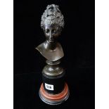 A 19th Century bronze bust - Head and shoulders of a lady, on red and black marble base – 12in.