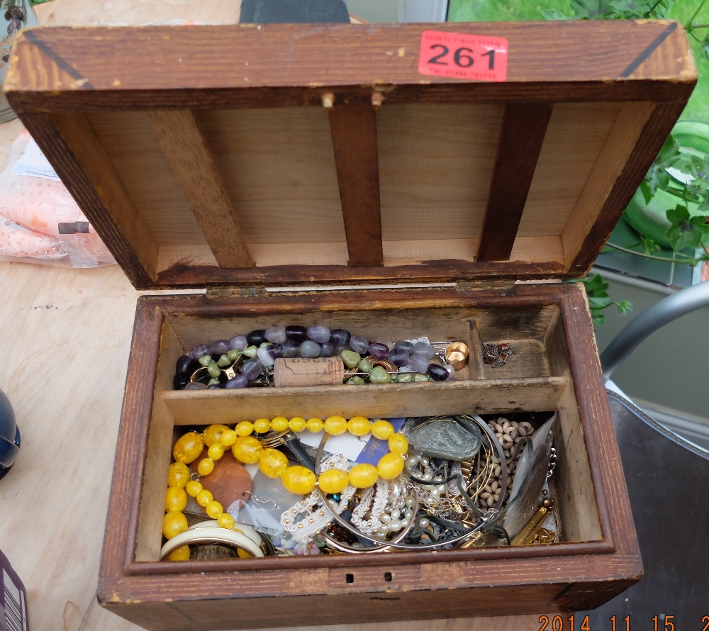 Wooden Box with Costume Jewellery.
Please ignore the Second image it does not pertain to this Lot.