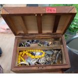 Wooden Box with Costume Jewellery.
Please ignore the Second image it does not pertain to this Lot.