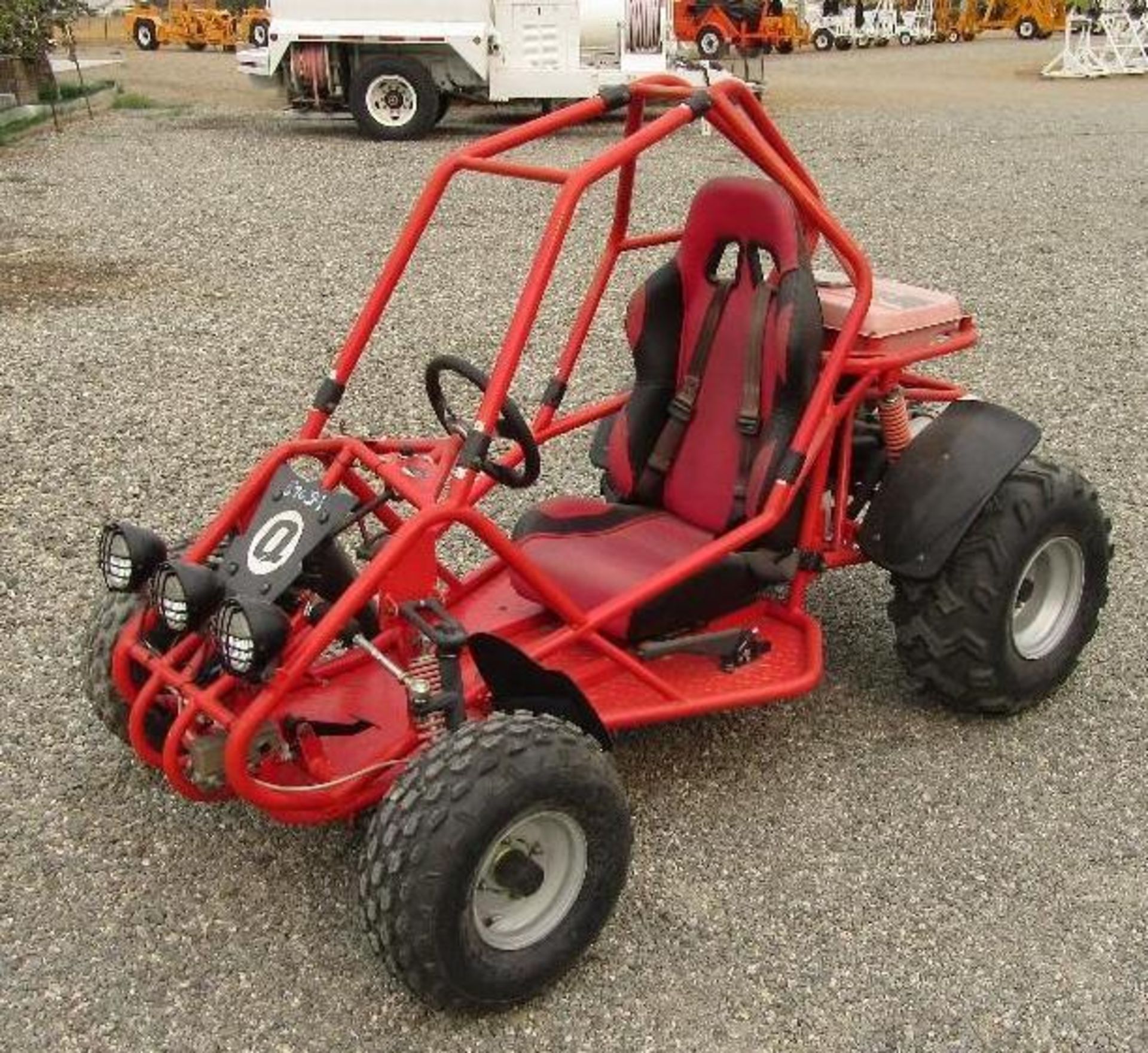Electric start, single cylinder motor. One seat.  Headlights Forward and reverse. Runs, drives and