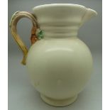 A Clarice Cliff jug, 895, height 23cm