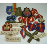 Twenty-two military patches and a Defenc