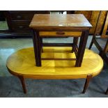A teak coffee table and a teak nest of t