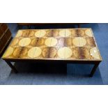 A Danish teak tiled top coffee table