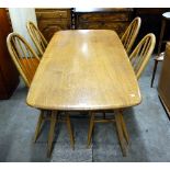 An Ercol table and four chairs