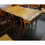 A teak table and four chairs