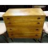 A teak chest of four drawers