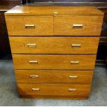 A teak chest of drawers