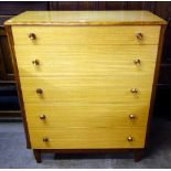 A teak chest of drawers