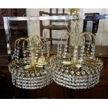 A pair of gilt metal chandeliers