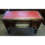 An oak leather topped desk