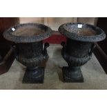 A pair of Victorian style cast iron camp