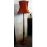 A red Japanned standard lamp