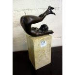 A bronze figure of a female nude, mounte