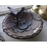 A cast iron bird bath