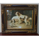 A print of two dogs, framed