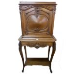 A 19th Century French Louis XV style walnut cabinet on stand, carved with shells and acanthus