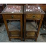 A pair of 19th Century continental inlaid oak marble top pot cupboards