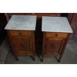 A pair of Edward VII oak marble topped pot cupboards