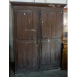 A Victorian pine two door cupboard