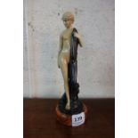 A reproduction Art Deco style figure of a lady