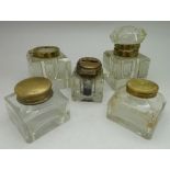 Five glass inkwells, one lacking top