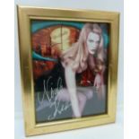 A signed photograph of Nicole Kidman, framed