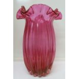 A cranberry glass vase, height 28cm