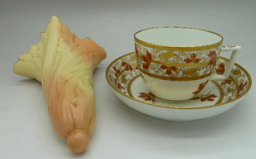 A Worcester Locke & Co. wall pocket and a late 19th Century cup and saucer, three small chips to