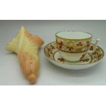 A Worcester Locke & Co. wall pocket and a late 19th Century cup and saucer, three small chips to