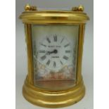 A brass and glass cased mantel timepiece, the dial signed Elliott & Son, London, one glass panel