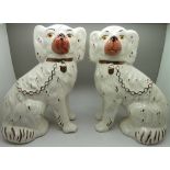 A pair of Staffordshire spaniels, height 28cm