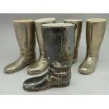 Five silver plated measures in the form of riding boots