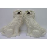 A pair of Staffordshire Spaniels, height 29cm
