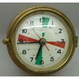 A German brass cased battery wall clock, diameter 13.5cm