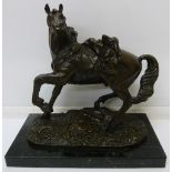 A late 19th Century French bronze figure of a war horse, indistinctly signed to the base, mounted