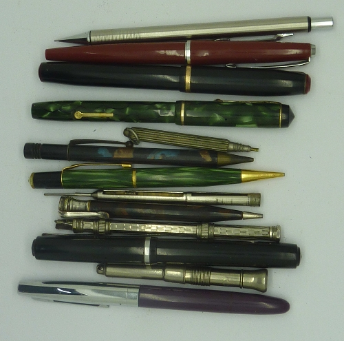 A Conway Stewart green marbled ink pen with 14ct gold nib and other pens and pencils