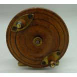 A wooden fishing reel