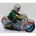 A tin plate clockwork motor cycle, made in China