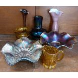 A blue Carnival glass dish, an amethyst Carnival glass dish, a Ditchfield style glass vase,