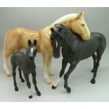 Two Beswick horses, Black Beauty, Black Beauty foal and one other model horse