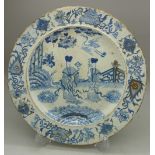 A Mason's ironstone blue and white plate decorated with Chinese figures, diameter 23.